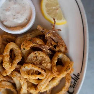 Fried calamari with lemon wedge and aioli at The Carlile in Downtown Seattle