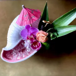 Cocktail served in a conch shell at The Carlile in Downtown Seattle