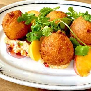 Hush puppies with peach wedges &amp; parsley at The Carlile in Downtown Seattle