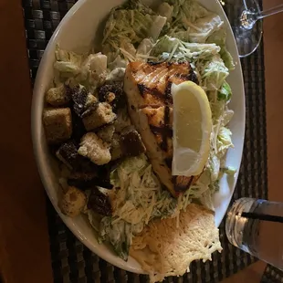 Caesar salad with salmon.