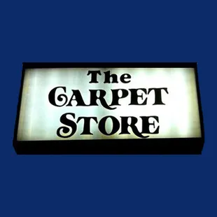 a sign for a carpet store