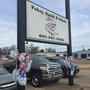 a sign for poloy sands and salads