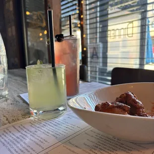 Two drinks and wings.