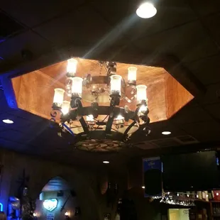 a chandelier and a bar