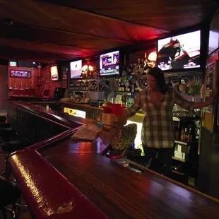 a woman standing at the bar