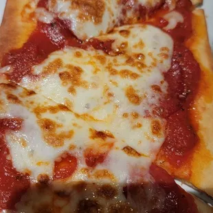 a slice of pepperoni pizza