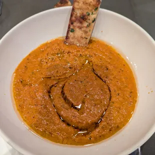 Housemade tomato bisque soup with housemade aioli and parm flatbread.