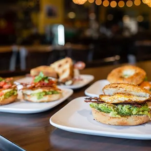 three plates of sandwiches