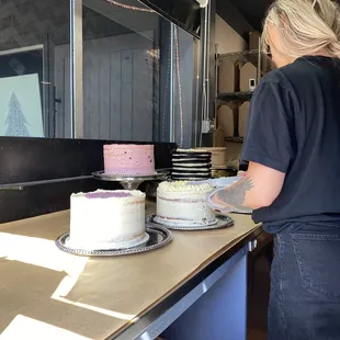 a woman cutting a cake