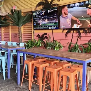a bar with a television on the wall