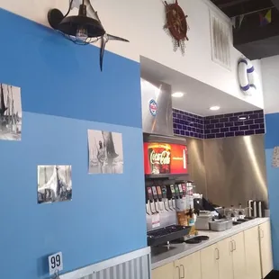 Drink station and condiment bar are open. Check out the dark blue tile.