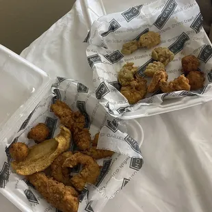 two trays of fried food