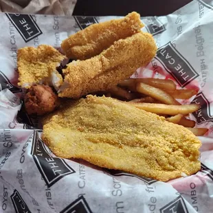 Medium Fried Catch... 2 catfish filet, fries and 2 hushpuppies.