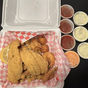 Combo basket of 2 fried catfish, 4 fried shrimp, 2 hush puppies and fried okra. Everything was delicious!