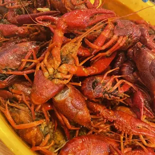 a yellow bowl full of craws