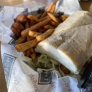 a sandwich and fries in a basket