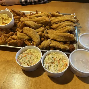 Chicken, shrimp, and catfish feast with coleslaw and okra