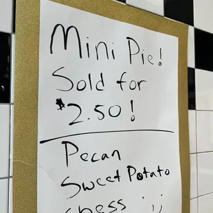 a sign on the wall of a subway