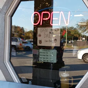 the open sign in the window