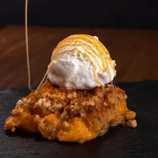 Peach Bischoff Crumble

A warm and comforting peach crumble topped with Bischoff crumbles, paired with vanilla ice cream.