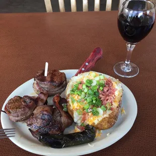 Steak Medallions with a Loaded Baked Potato and Grilled Jalapeño. On the side is their fabulous Llano Estacado Sweet Red.