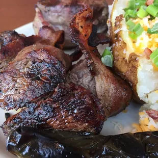 Close up of the most amazing steak medallions!!  Grilled to perfection over pecan logs.
