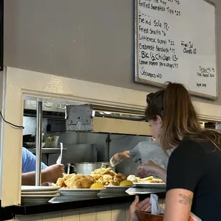 a woman serving food