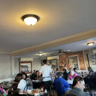 a large group of people sitting at tables