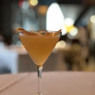 a cocktail in a glass on a table