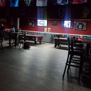 a bar with tables and chairs