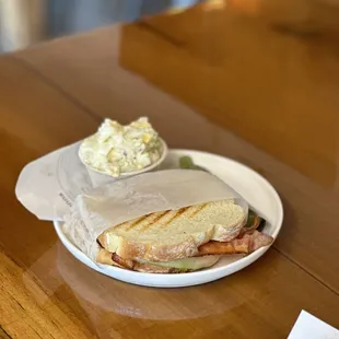 a sandwich on a paper plate