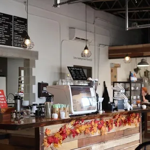 a coffee shop with a wooden counter