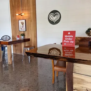 a table and chairs in a coffee shop