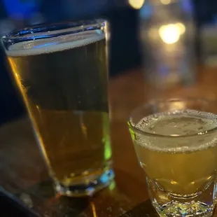 two glasses of beer on the bar