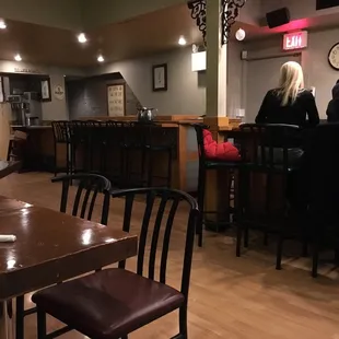 people sitting at the bar