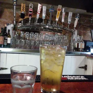 a glass of lemonade and a shot of lemonade