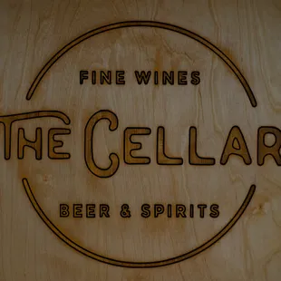 a wooden sign with the words fine wines