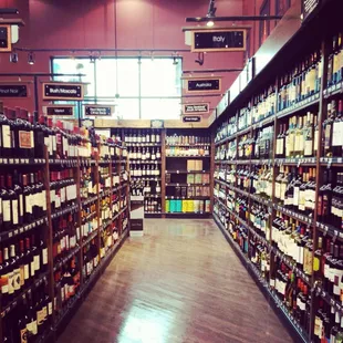 rows of wine bottles in a store