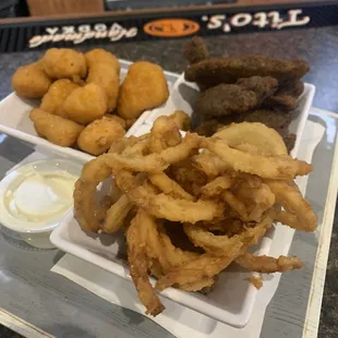 Family mix appetizers-onion straws, cheese curds and portobello mushrooms