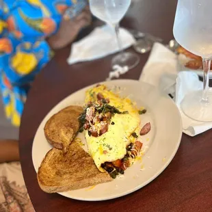 a plate of food and a glass of water