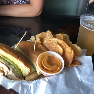 a sandwich and chips on a table