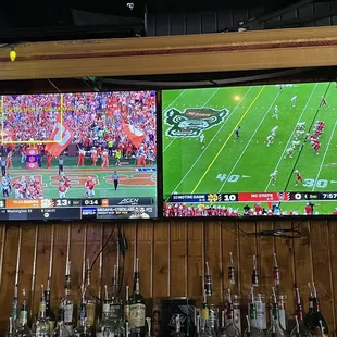 a football game being played on tvs