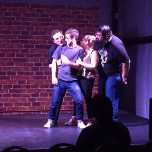 a group of people on stage