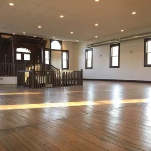 The Hall in the early morning sunshine.  Subtle natural light bounces off the hardware floors.