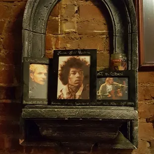 a portrait of jimi on a shelf