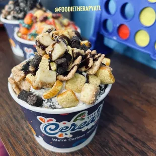 This is cookies and cream with Cinnamon Toast Crunch cereal topped with brownie and cheese cake chunks.