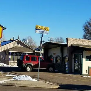 a car parked in front of a restaurant