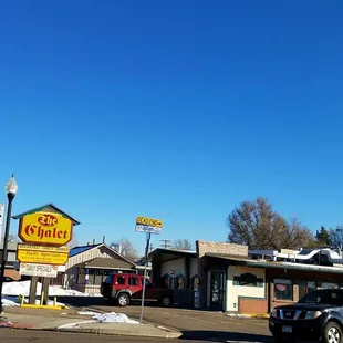 a car parked in front of a restaurant