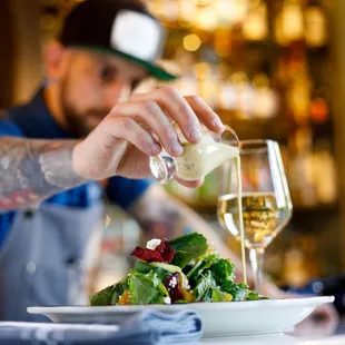 Drizzle of dressing on the Kale and Beat Salad