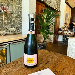 a bottle of champagne on a table